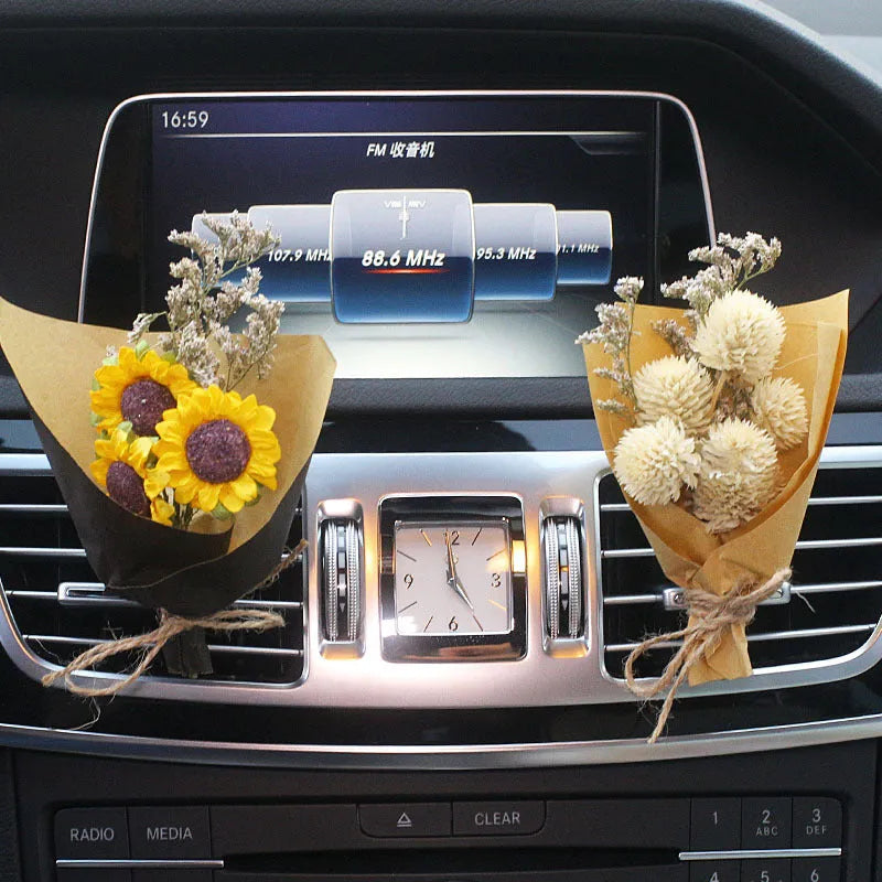 Mini dried flower bouquet clipped onto a car air vent, showing pink and white floral style.
