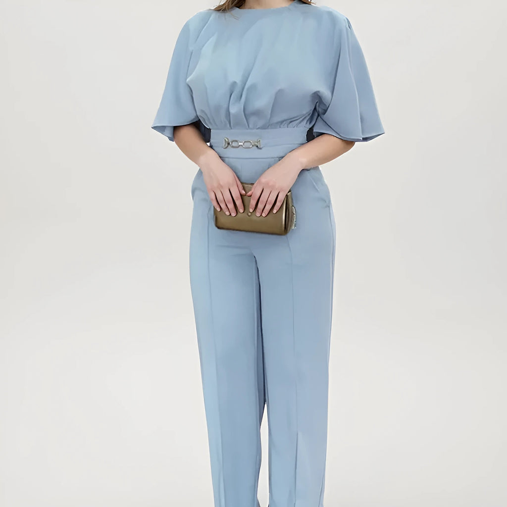 Blue polyester men's suit with long-sleeve jacket and trousers on a hanger.