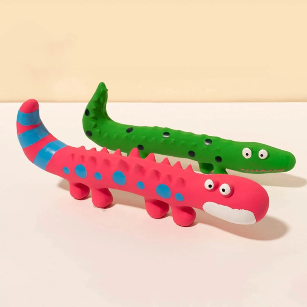 Green cartoon lizard shaped latex dog squeaky chew toy on a white background.