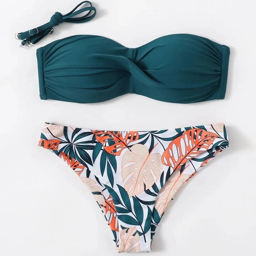 Green split push-up hard cup bikini top and coordinating briefs swimsuit laid flat.