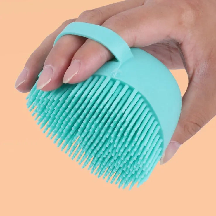 Blue silicone dog bath brush with soft bristles for washing and massage
