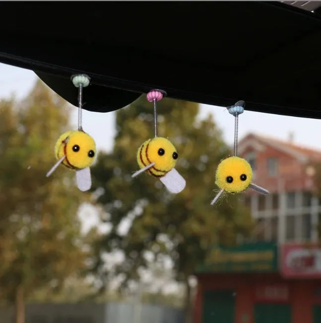 Small fur ball bee car decoration measuring 3cm square with cartoon design