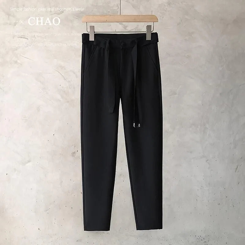 Boys slim straight wool trousers in tapered fit, shown in light grey colour.
