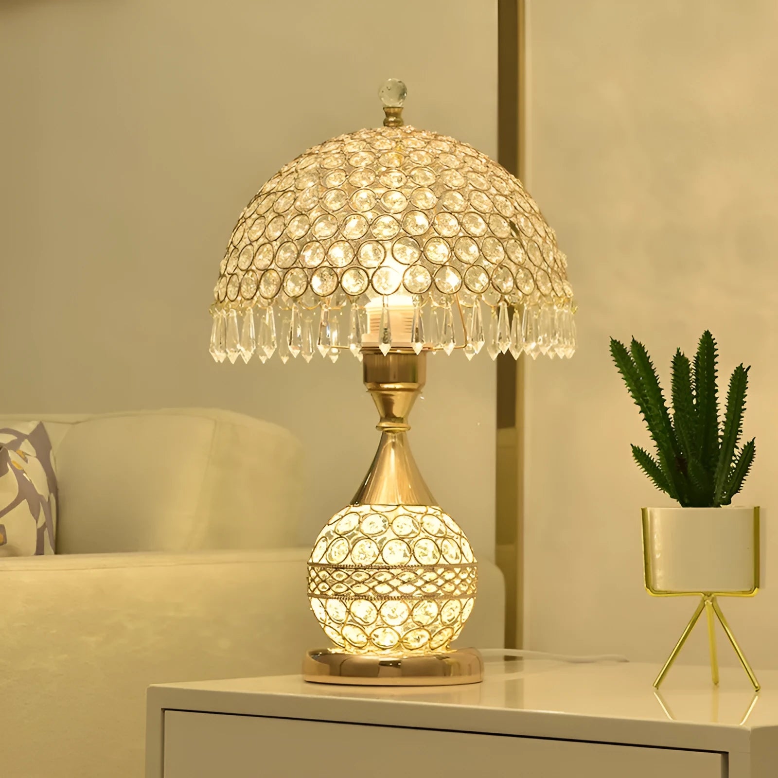 Gold crystal desk lamp with hand-finished pendant and iron art base on wooden surface