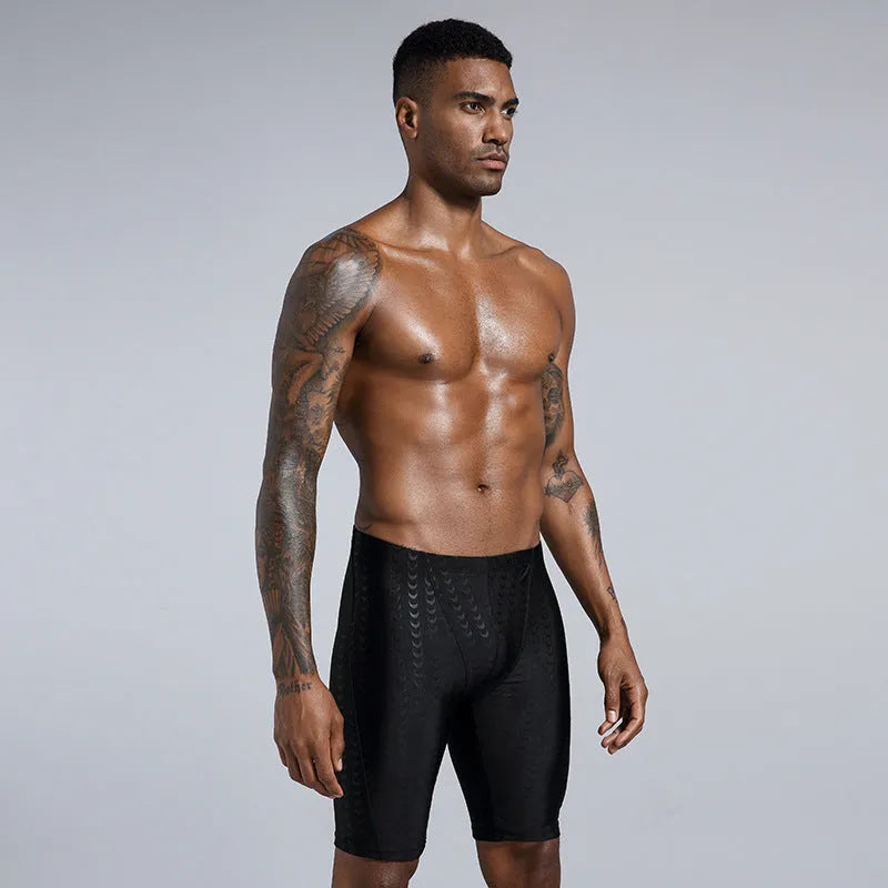Men's solid colour swimming trunks in waterproof shark skin polyester fabric, shown in larger sizes.