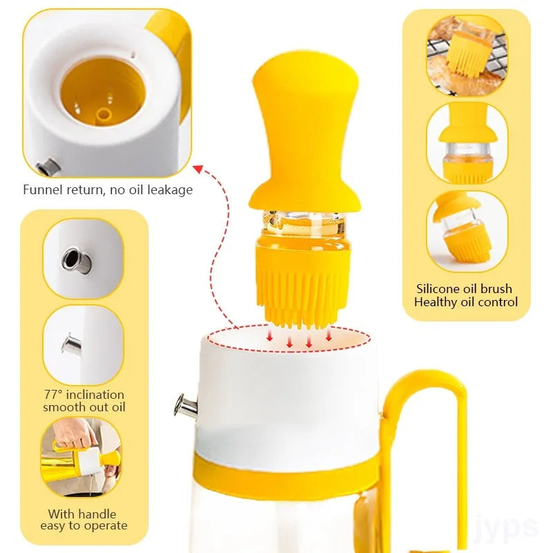 550ml clear glass oil dispenser bottle with stainless steel spray nozzle and a yellow silicone brush head attached.