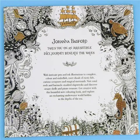 Lost Ocean DIY Coloring Book open to a detailed marine life page with coloured examples
