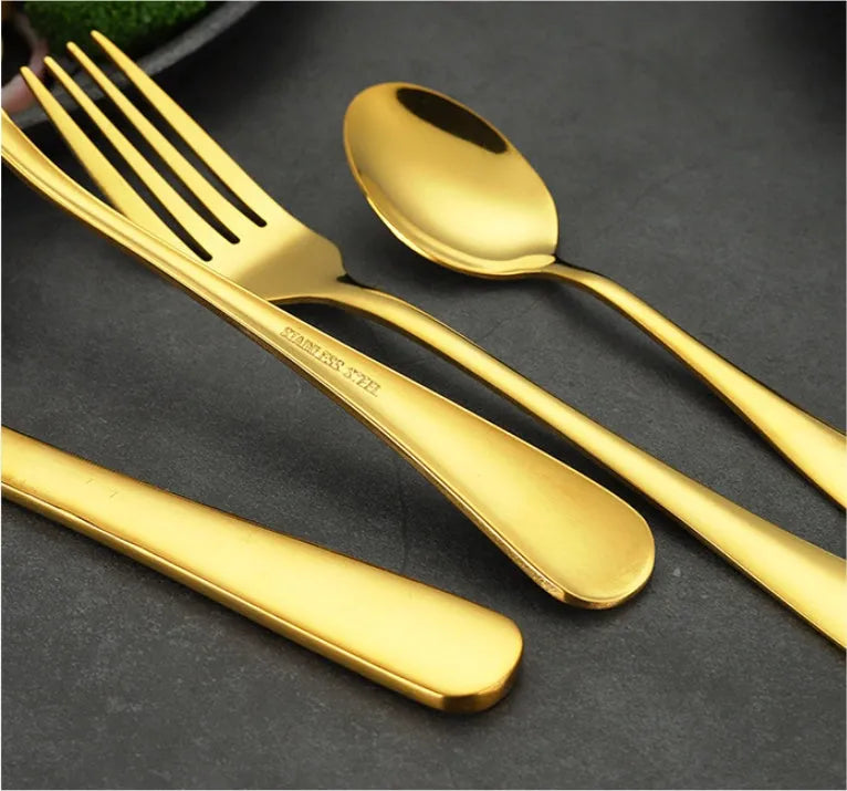 24-piece stainless steel cutlery set showing table knives, forks, and spoons in a gold colour option.