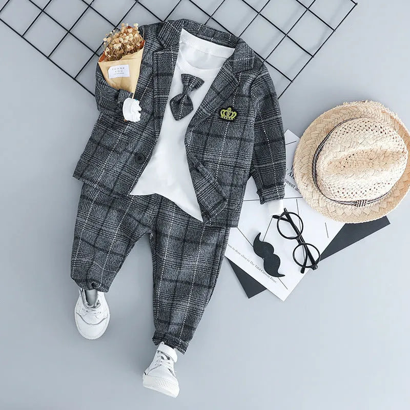 Infant boy's grey three-piece suit with long sleeves on a hanger.