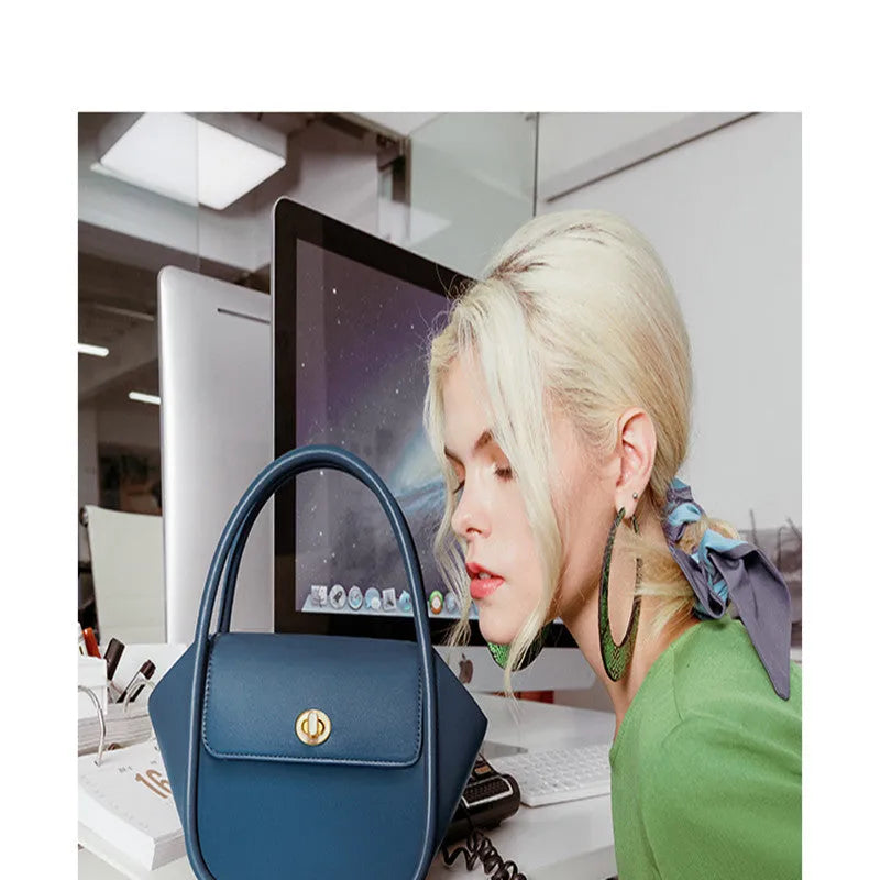 Winged shape leather tote handbag with a buckle and cross-body strap in cow leather