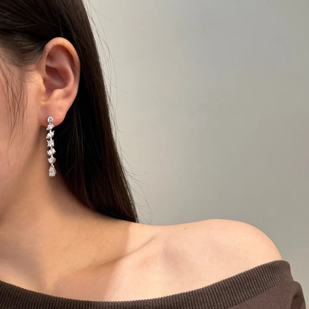 Pair of 925 silver tassel irregular asymmetry drop earrings with electroplated finish on white background