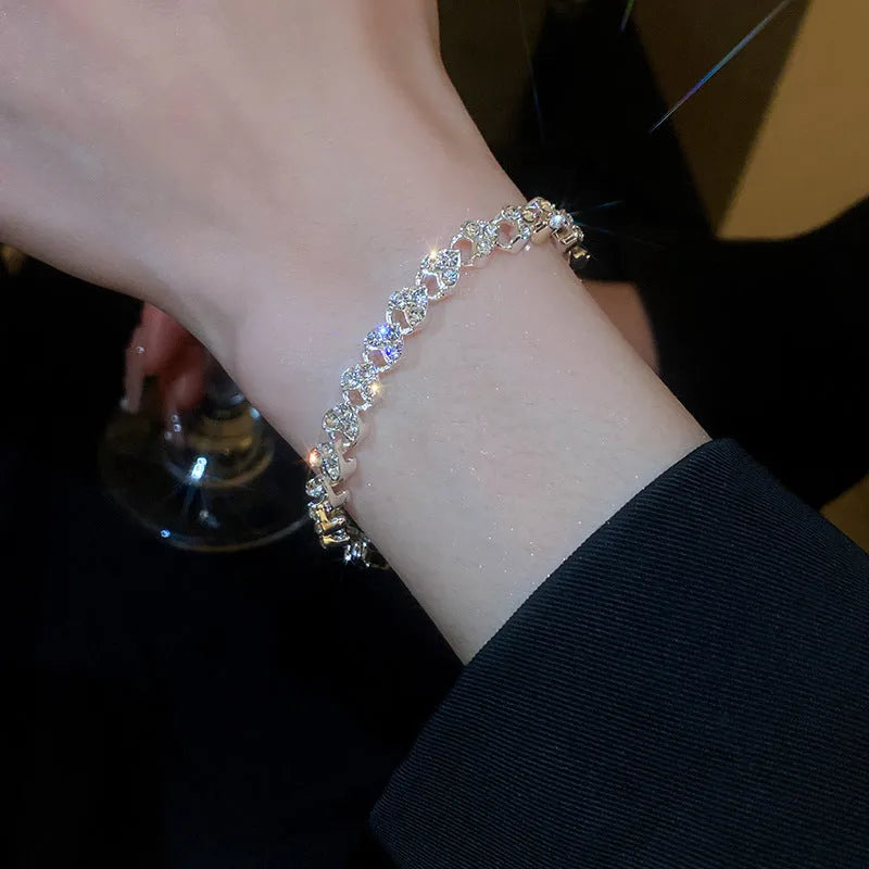 Silver metal bracelet with heart shape and inlaid zircon stones for women