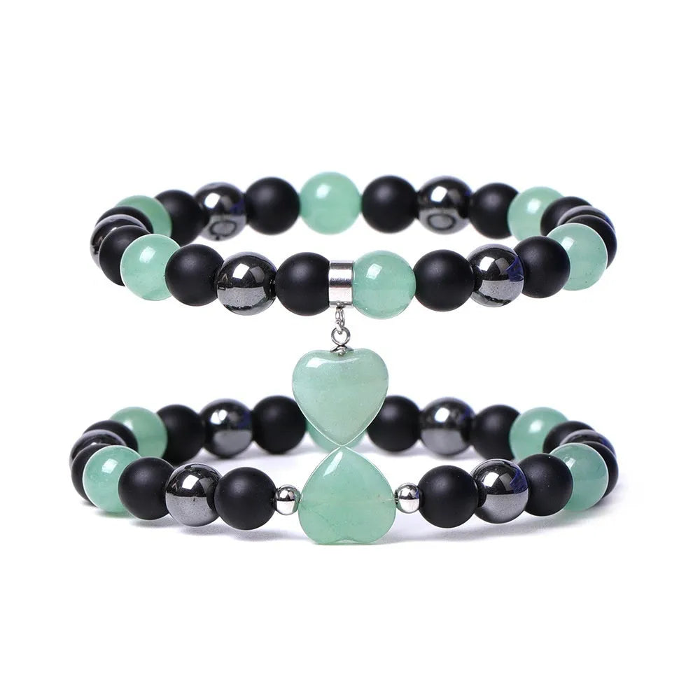 Hand-cut stone peach heart bracelet in Tigereye with geometric design and celestial moon planet motifs