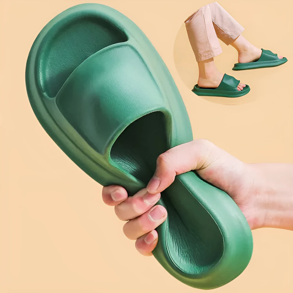 Pair of thick-soled white EVA flip-flop slippers with a non-slip patterned sole.