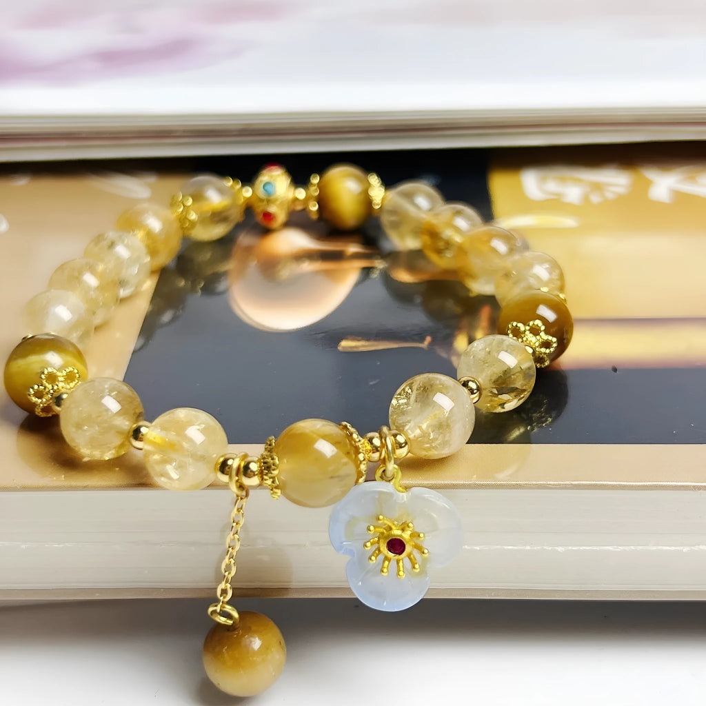 Handcrafted citrine crystal bracelet for women with a flower tassel in original design.