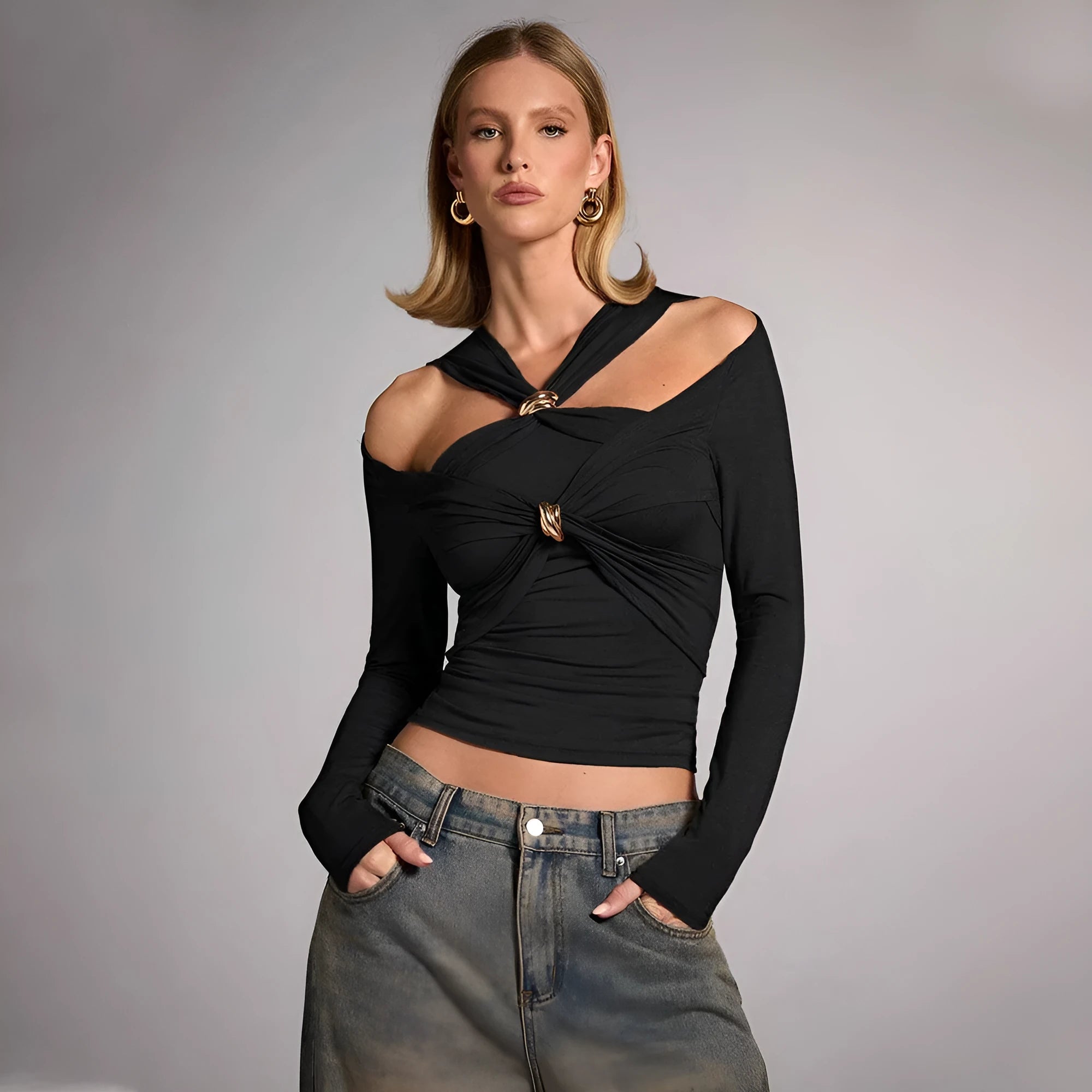 Black women's halter top with long sleeves and a slim fit on a mannequin.