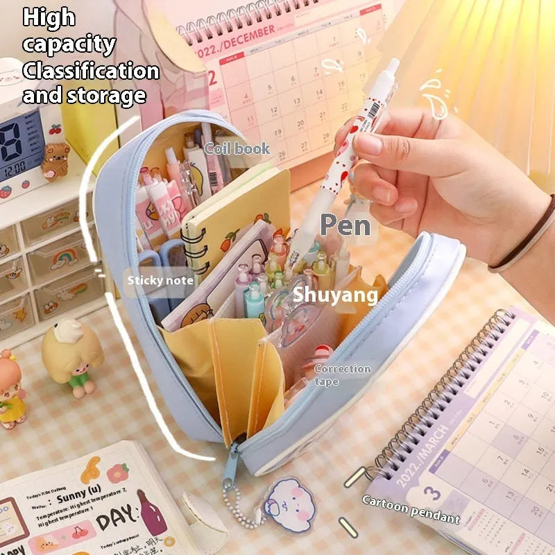 Transparent PVC student pencil case with Korean-style cartoon design showing stationery storage capacity