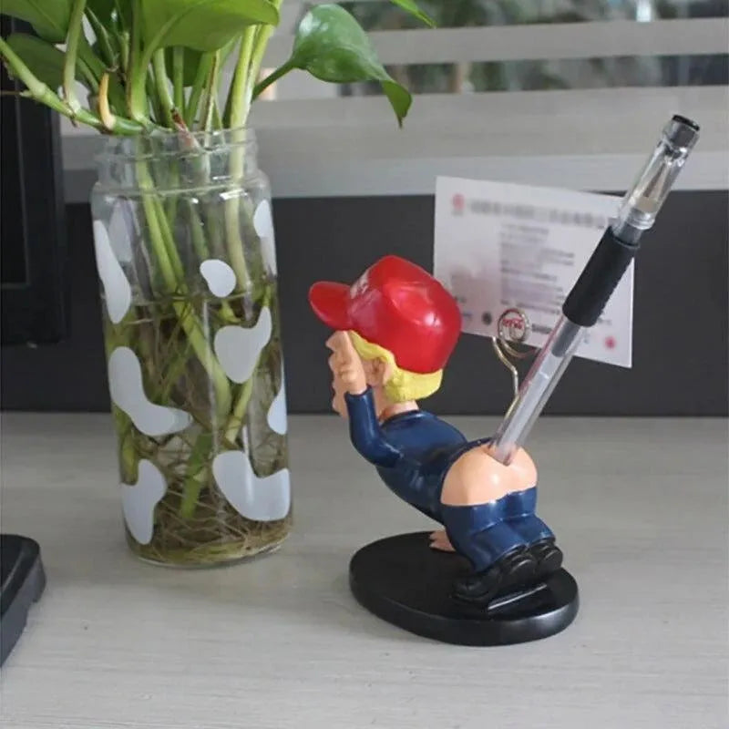 Blue resin pen holder with shaking head doll design, holding pens and business cards on a desk