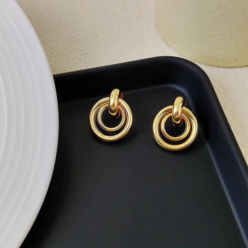 Geometric round ring earrings with irregular exotic design in gold or silver electroplated finish