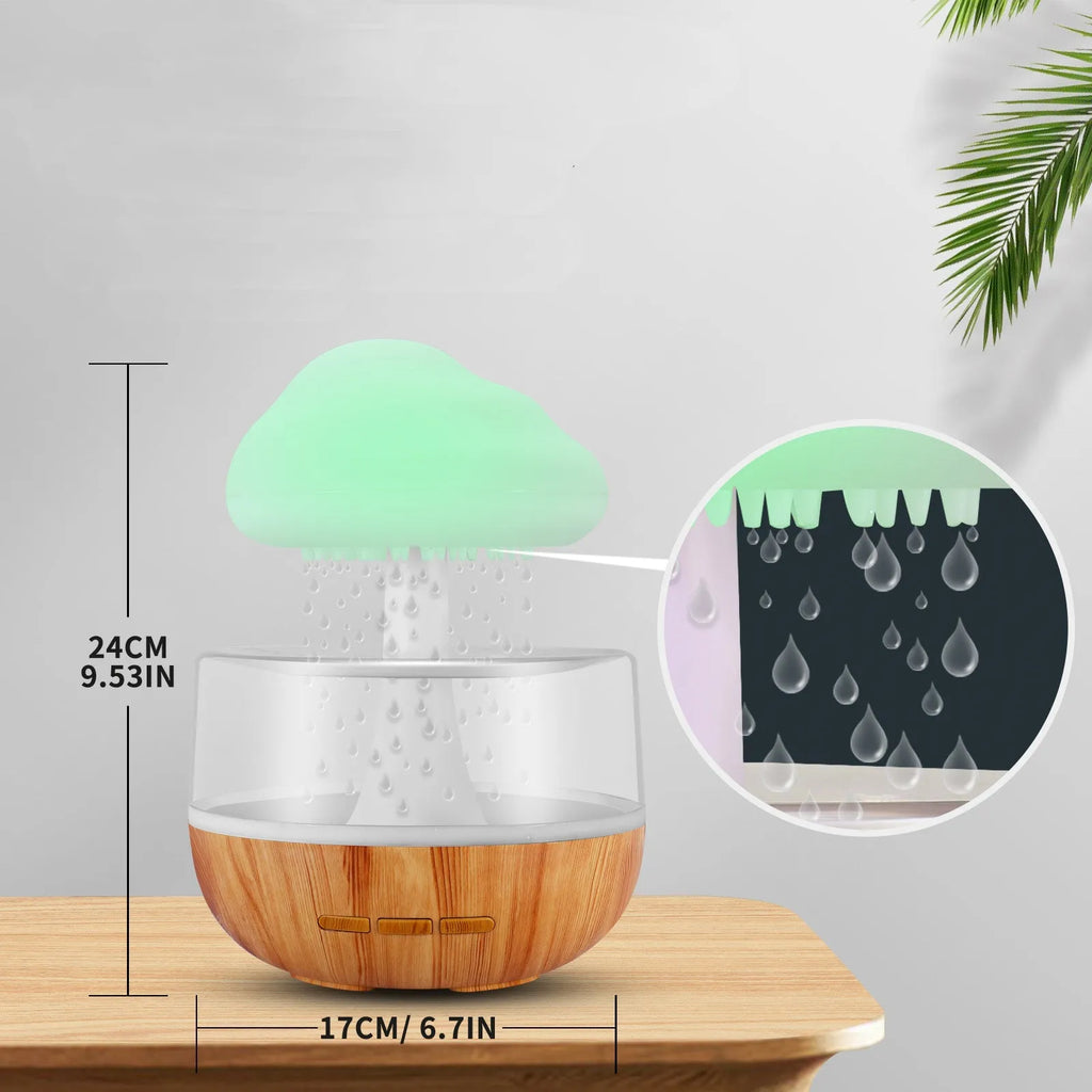 White portable USB humidifier with night light and essential oil diffuser on a wooden surface.