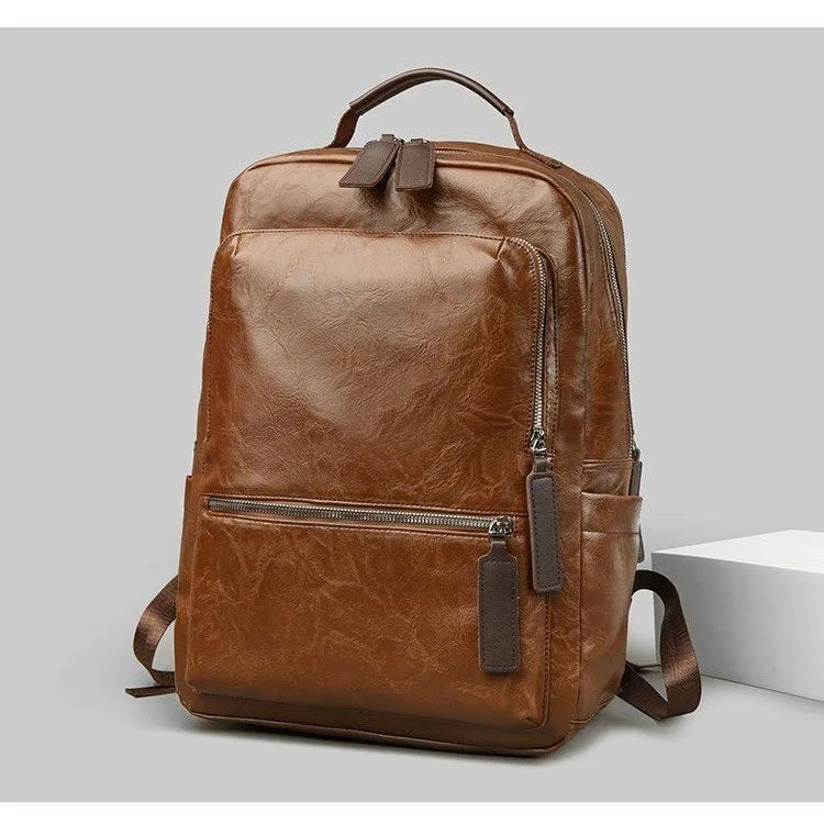 American vintage waterproof backpack 20-35L with PU lining and curved shoulder straps in black, brown, dark brown, or yellowish brown.