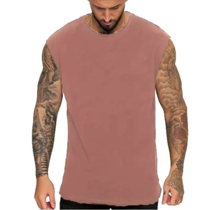 Men's loose fit cotton tank top in solid colours showing sleeveless design and straight hem