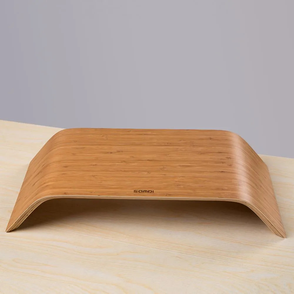 Walnut stability bracket laptop stand in bamboo leather colour, 23x51x9cm, on a desk