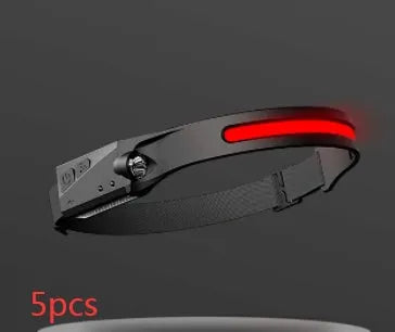 Black USB rechargeable headlamp with a wide COB LED lens and a side wave sensor on the headband.