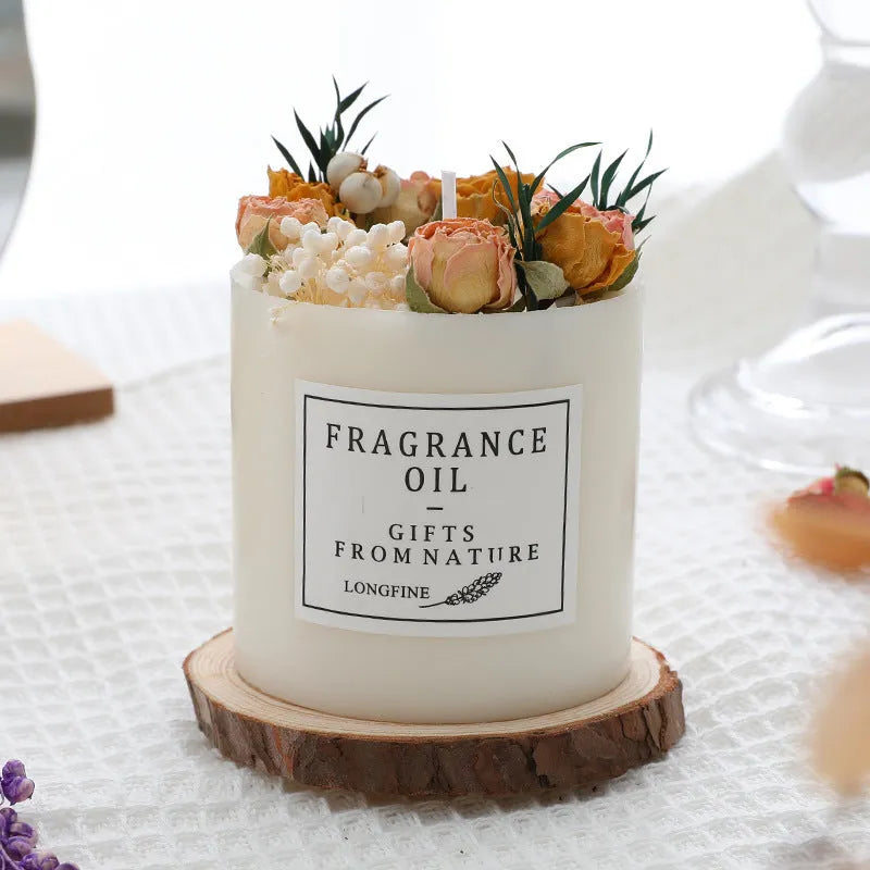 Decorative dried flower scented candle with choice of nine aromas on a wooden chip base.