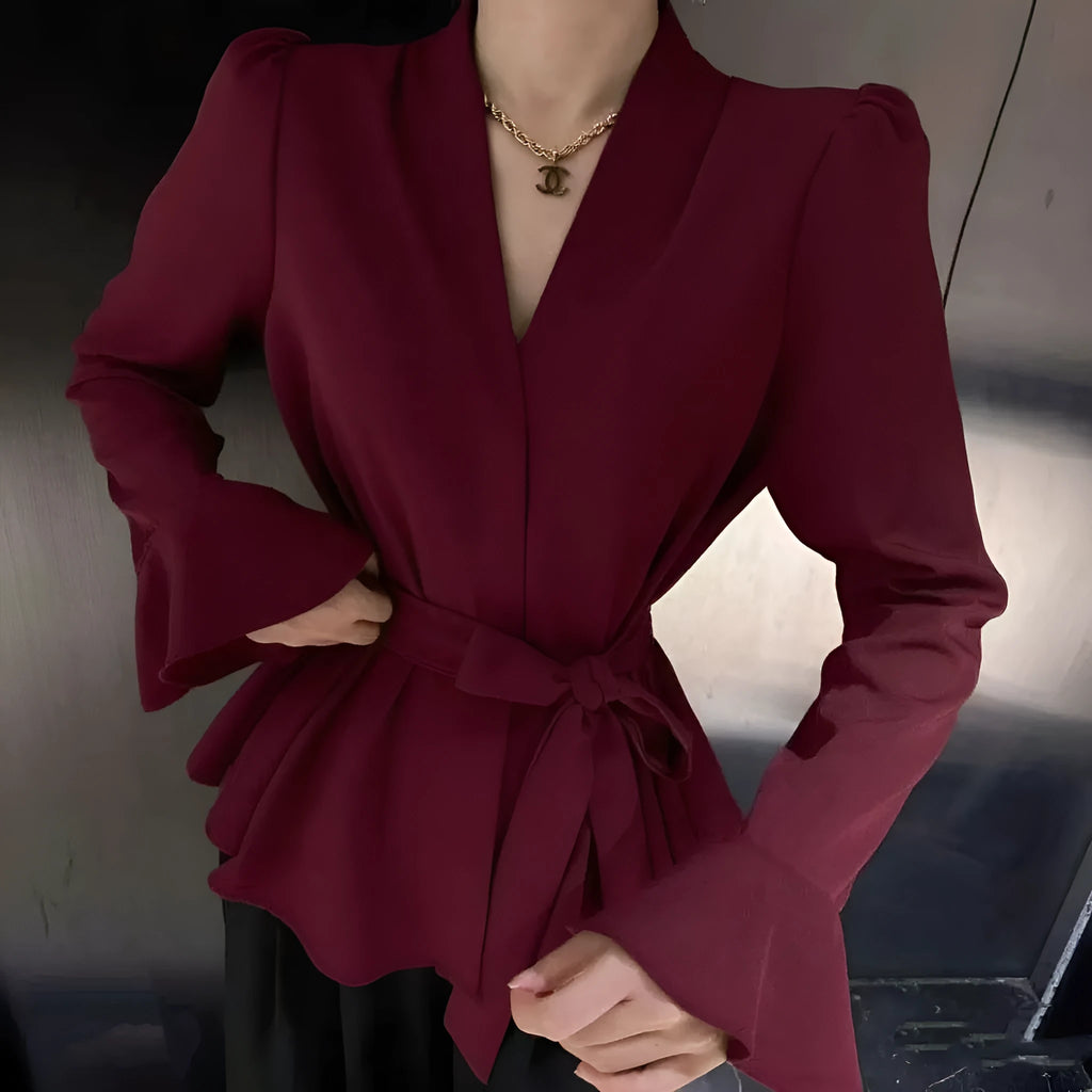 Black women's French-style shirt with irregular collar, long bell sleeves and tied front detail.