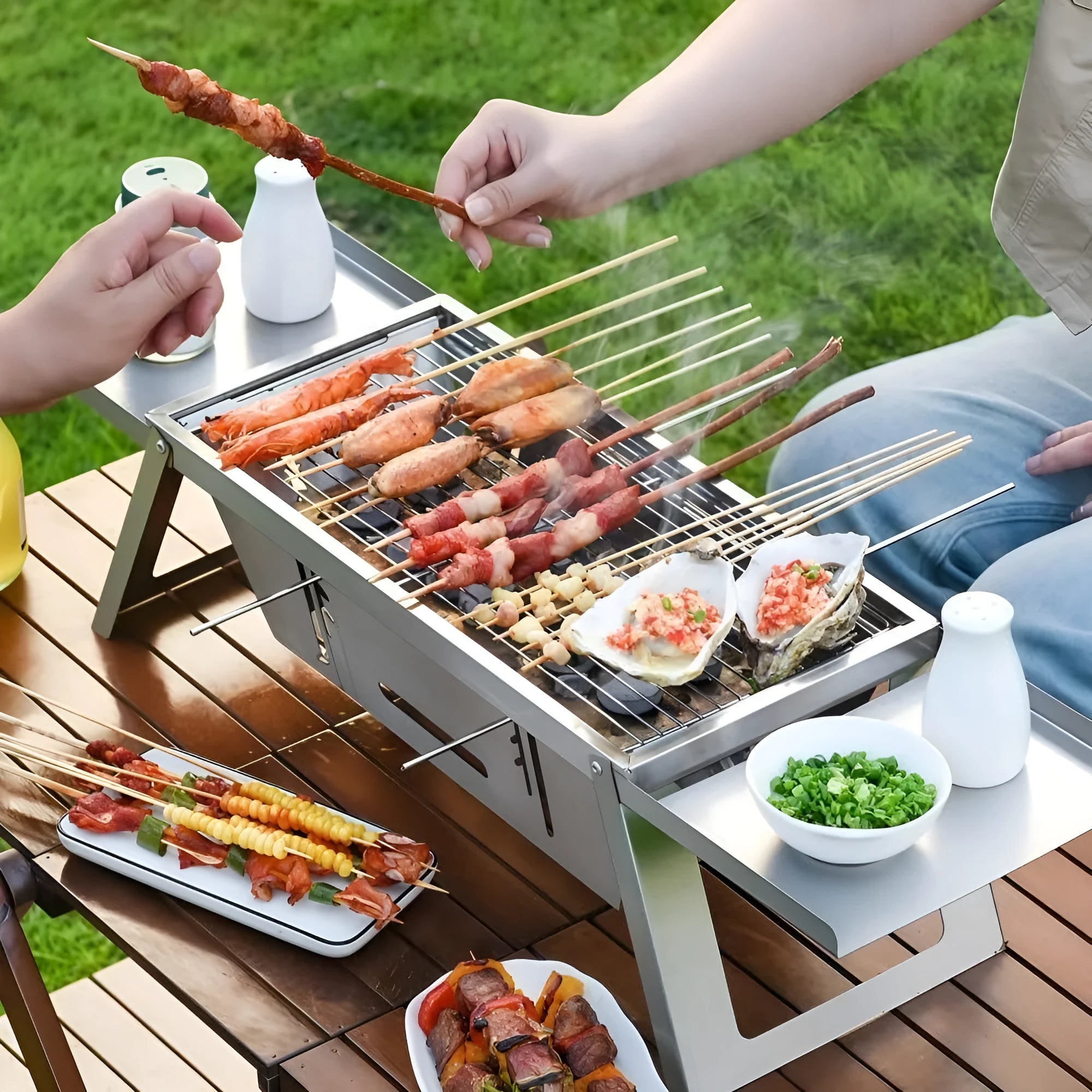 Flat-folded portable charcoal barbecue grill next to its unfolded cooking position