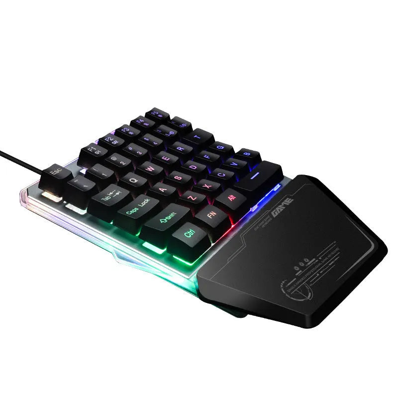 Black G40 Flow one-handed mechanical keyboard with RGB backlit keys on a desk.