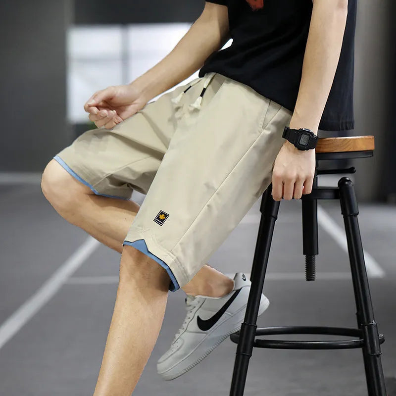 Man and woman modelling loose-fit casual beach shorts in South Korea style, available in multiple colours.