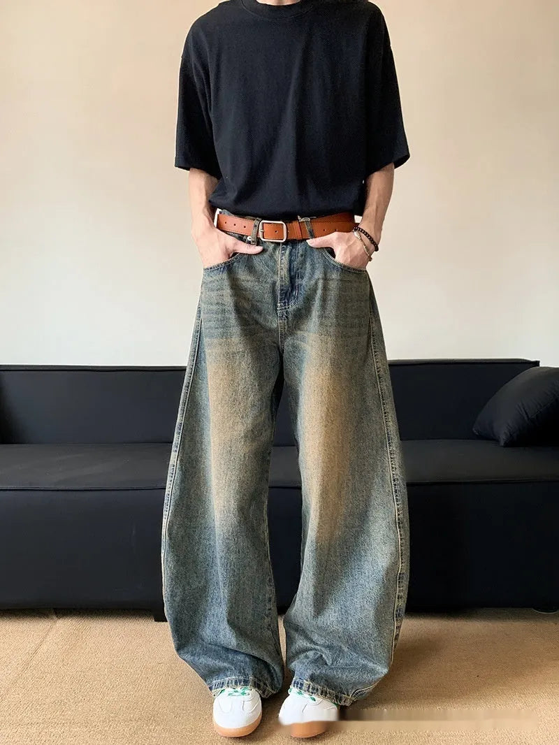 Men's distressed denim jeans in retro blue colour with wide-leg design and mid-waist fit