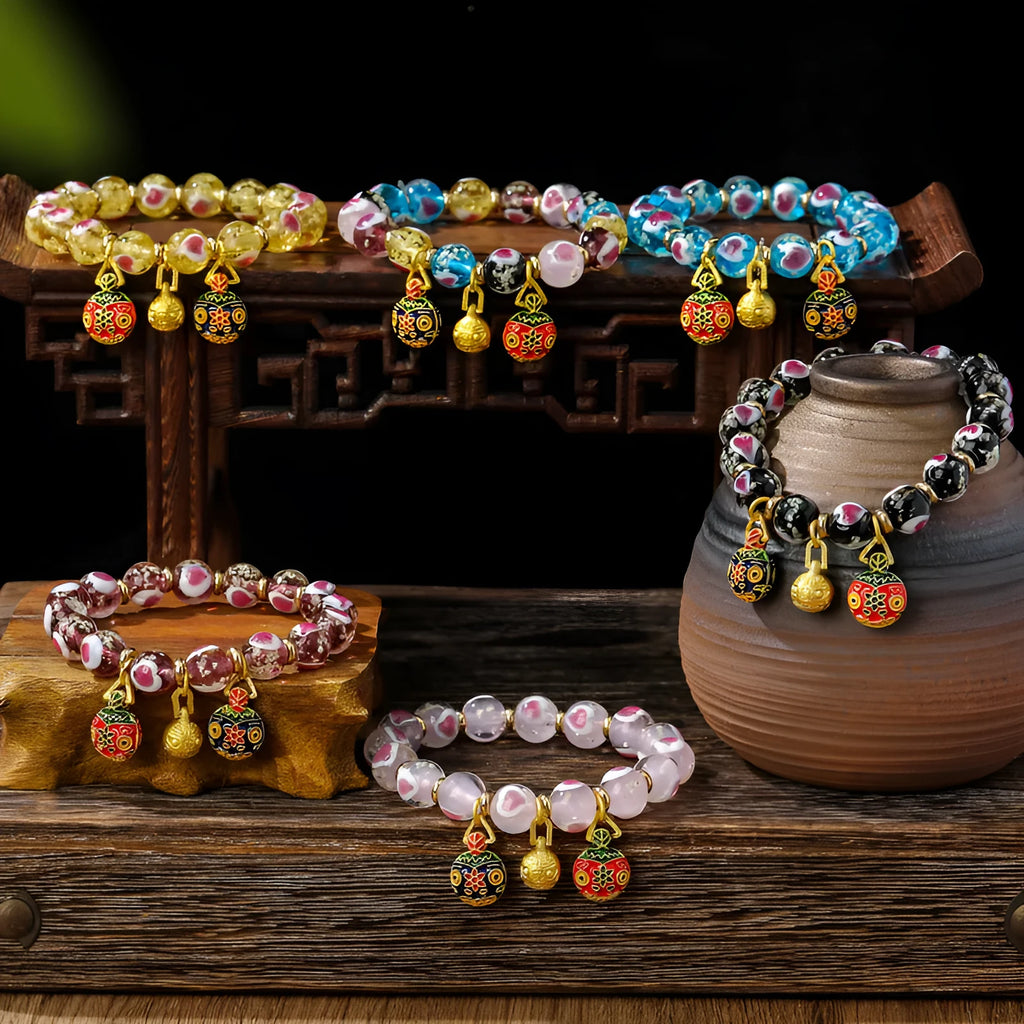 Handmade heart-shaped glass bead bracelet with ancient fluorescent glaze and swallowing gold beast design