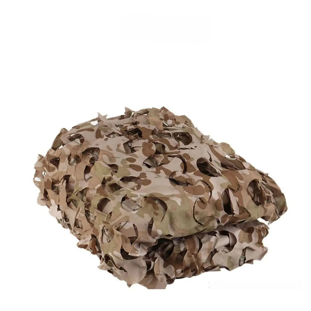 Green camouflage netting cover shown in a desert camouflage pattern, laid over outdoor terrain.