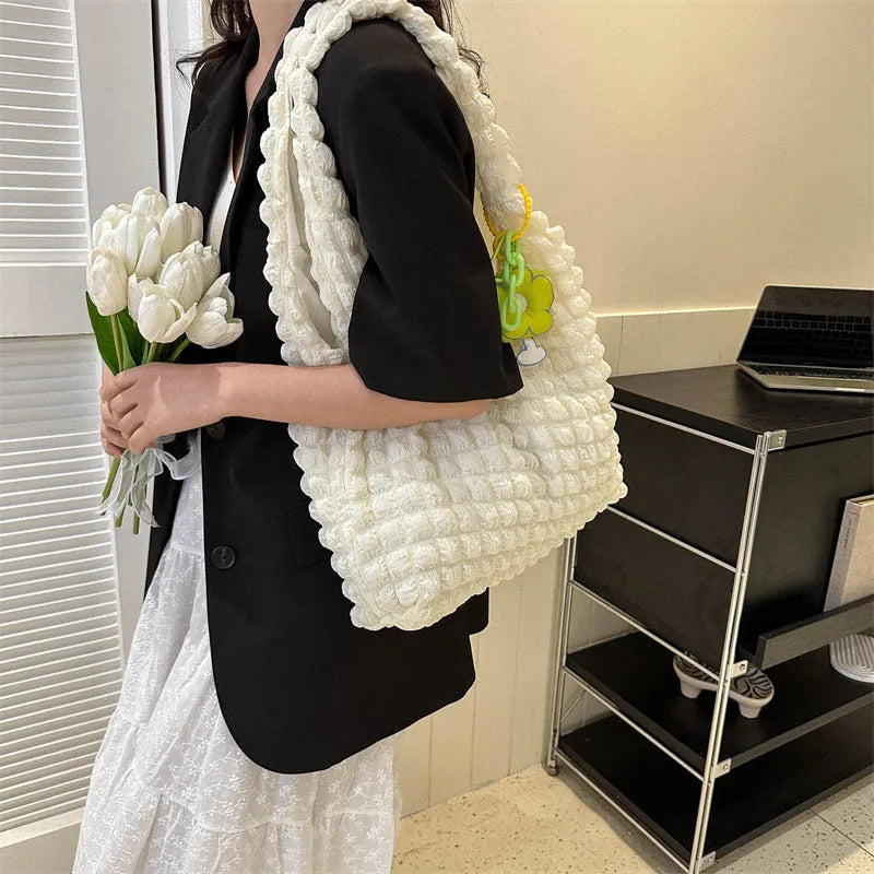 Soft pleated polyester women's crossbody bag in square shape with detachable pendant.