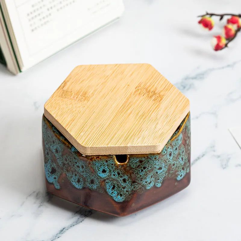 Ceramic ashtray with lid, Nordic style, available in multiple colours, on a tabletop
