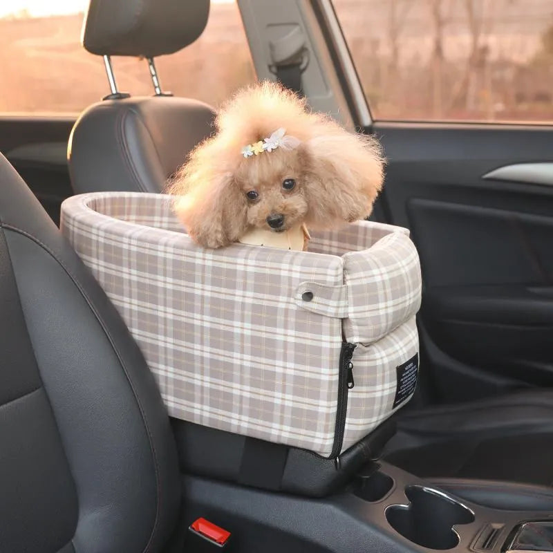 Portable pet car seat booster kennel in black grid with flip-top cover on car armrest, suitable for small dog or cat travel