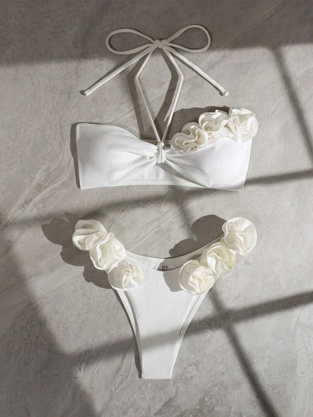 White halter neck lace-up swimsuit bikini set with three-dimensional floral pattern on briefs