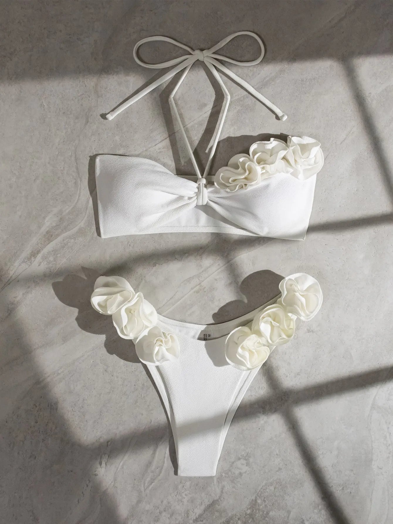 White halter neck lace-up swimsuit bikini set with three-dimensional floral pattern on briefs