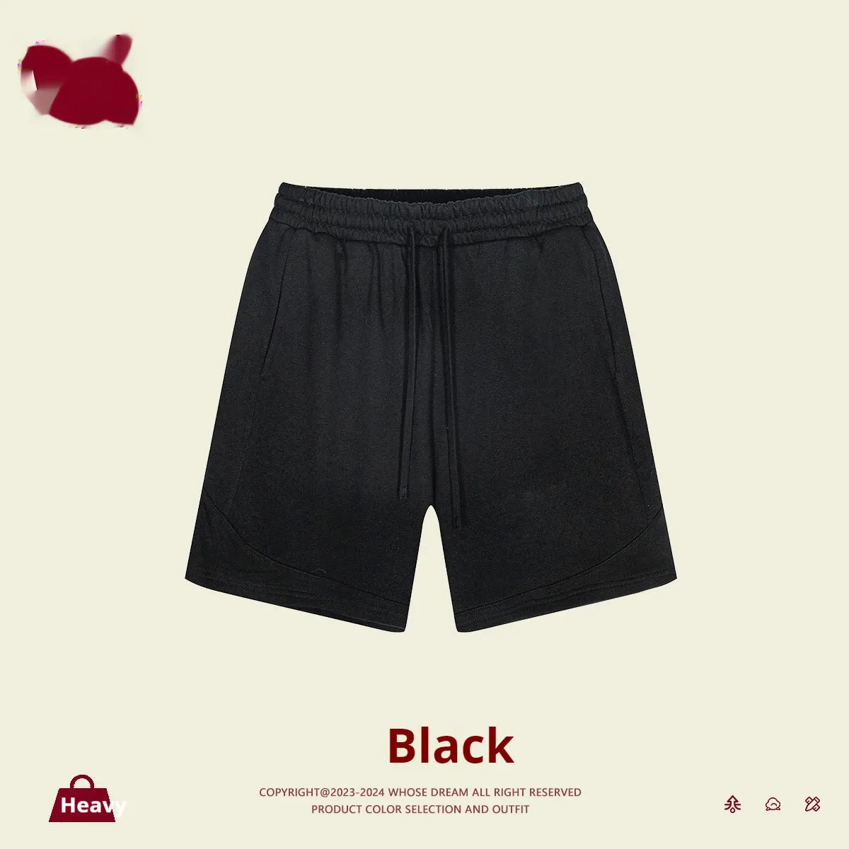 Child wearing solid colour loose cotton sports shorts in a neutral shade.