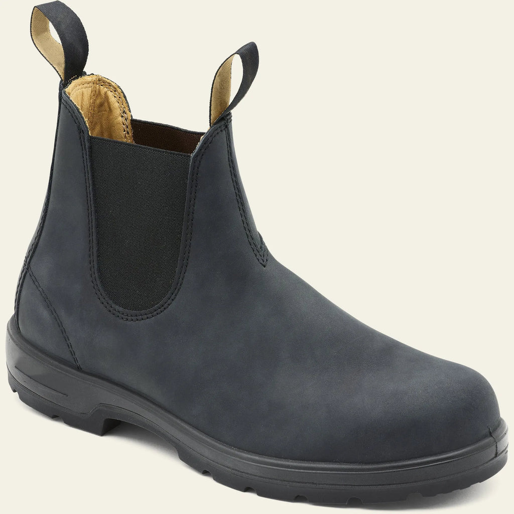 Vintage grey unisex Chelsea boots on a wooden floor, showing frosted PU upper, round toe, low heel, and car stitch detail.