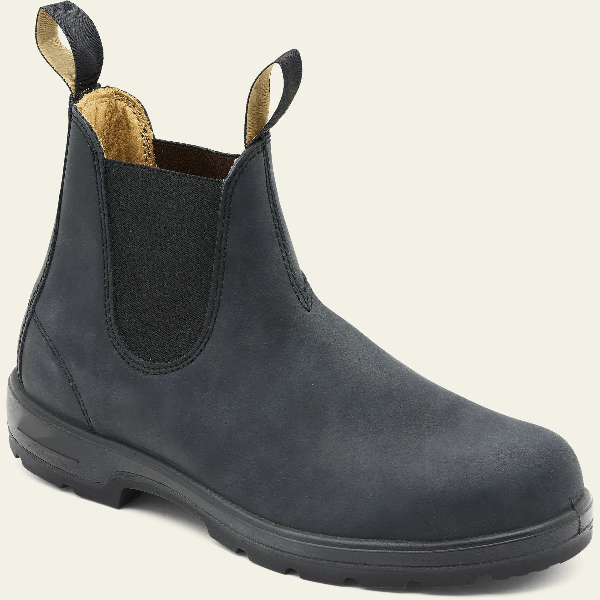 Vintage grey unisex Chelsea boots on a wooden floor, showing frosted PU upper, round toe, low heel, and car stitch detail.