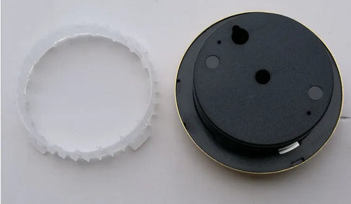 Analogue thermometer and hygrometer with silver aluminium dial and outer ring.