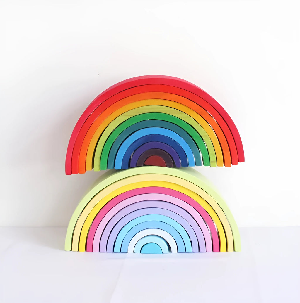 12-piece wooden arch bridge rainbow building blocks made from New Zealand pine with light lacquer finish on a flat surface