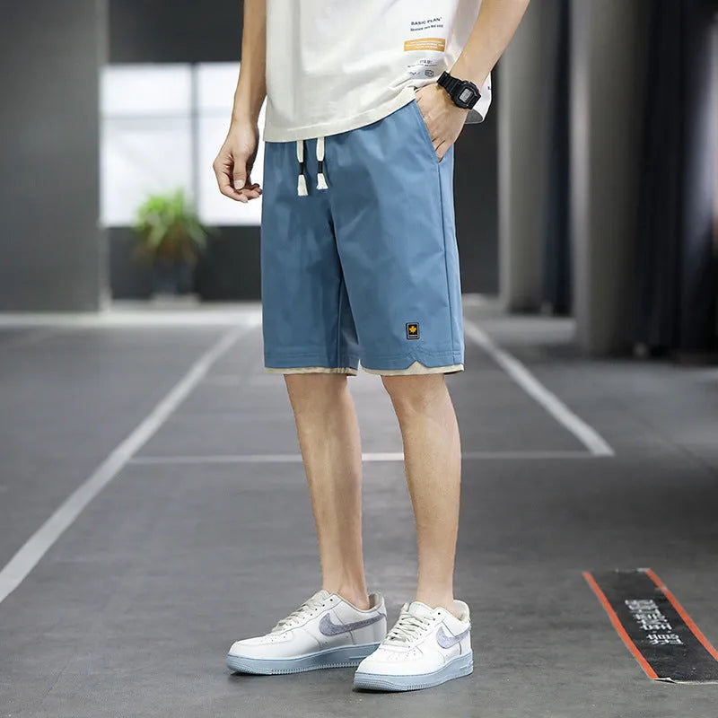 Man and woman modelling loose-fit casual beach shorts in South Korea style, available in multiple colours.