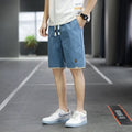 Man and woman modelling loose-fit casual beach shorts in South Korea style, available in multiple colours.