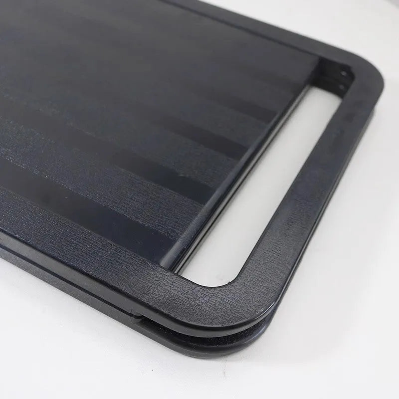 Double large folding hairdressing rearview mirror in black with HD double-sided reflective surface on a table