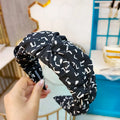 Pressed cloth hair accessory in U-shape with retro Korean style, available in six colours including black and red